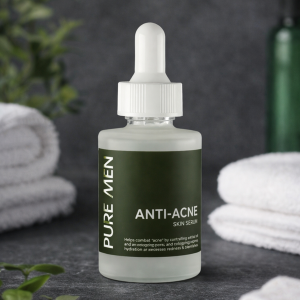 Bottle of Pure Men Anti-Acne Skin Serum on a dark surface with towels and cotton swabs in the background.