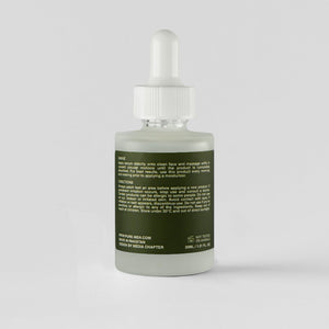 Skincare dropper bottle with green label on a white background