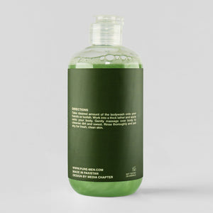 Green bottle with label on a gray background