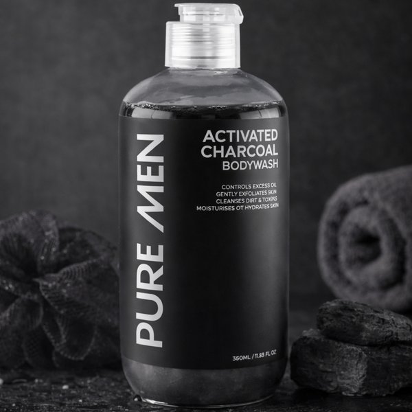 Bottle of Pure Men Activated Charcoal Body Wash with black background